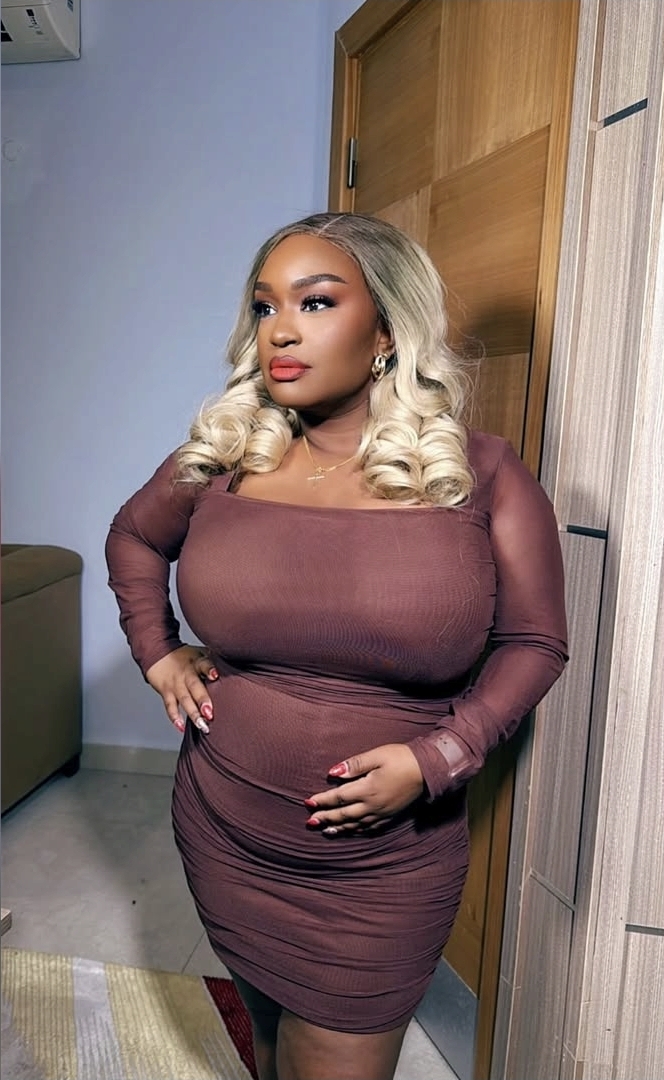 Woman with luxurious blonde curled wig install